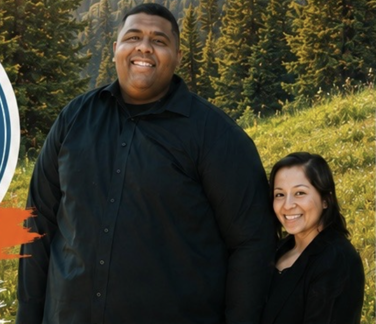Camp speaker Evan Moore with his wife, standing on a mountain meadow
